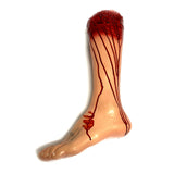 Foam Rubber and Vinyl Bloody Severed Left Foot Stump for horror movie, television or live theater props.