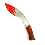 Kukri knife with bloody red blade and brown handle on a white background