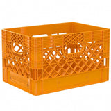 Orange 24 quart plastic Milk Crate used to store video audio cables and film grip equipment - Dependable Expendables